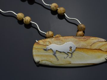 Sterling cut out leaping horse on landscape picture jasper