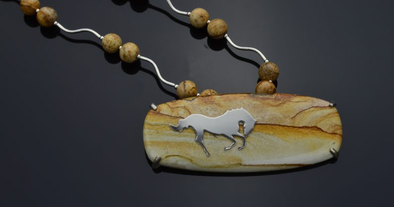 Sterling cut out leaping horse on landscape picture jasper