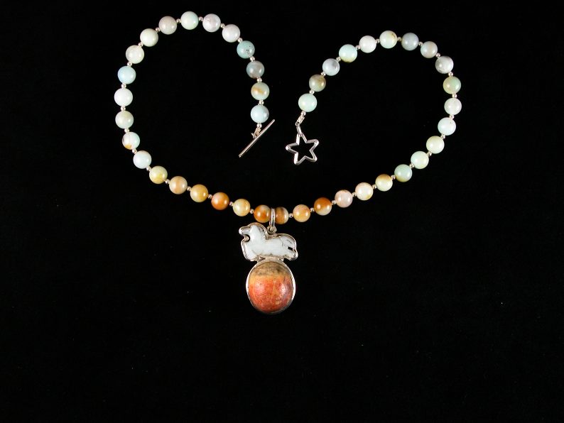 Jade horse jumping a red jasper moon