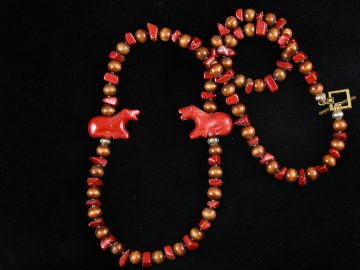 Two red jasper horses on jasper and wood bead necklace