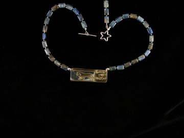 Sterling cut out jumper on brass with brass moon