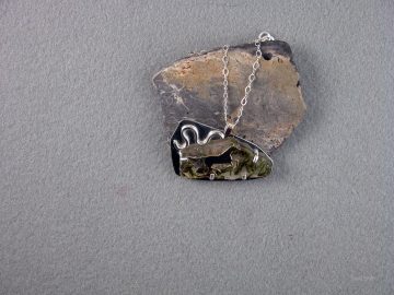 Horse running on epidote quartz