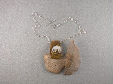 Sterling grazing horse on brown jasper pendant
