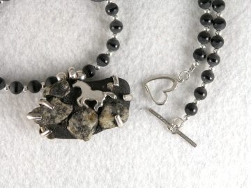 Fine silver cantering horse on stone from Botany Island, SC