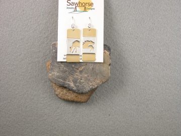 Two sterling cut out horses