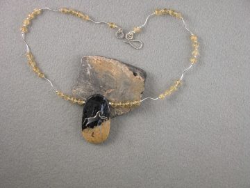 Horse leaping on petrified palm wood