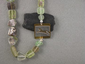 Leaping horse on brass