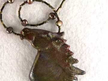 Raku pottery horse head on necklace of freshwater pearls