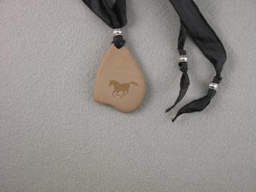 Horse galloping on beach stone
